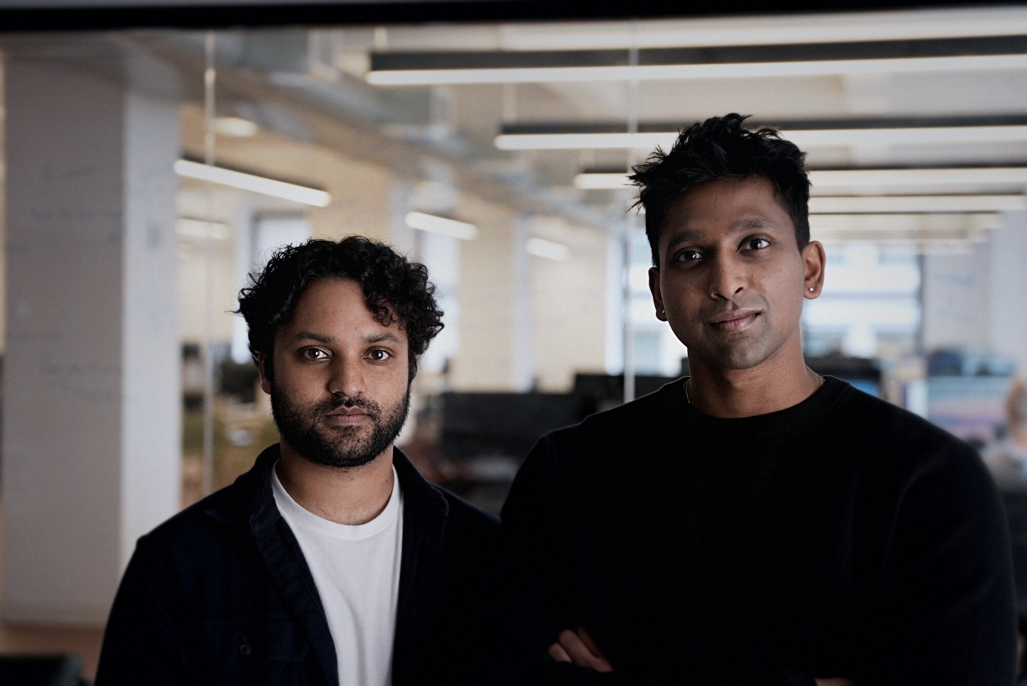 Sri and Rish standing together in the office