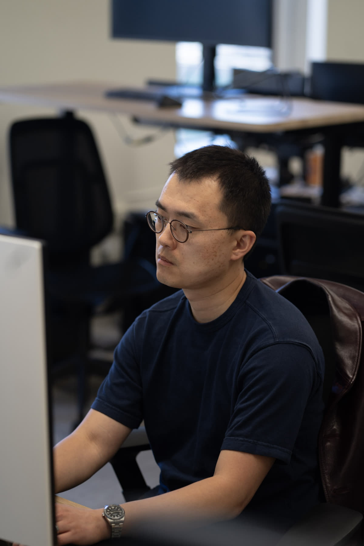 Engineer focused at a monitor